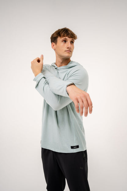 Male model wearing an ALL IN ALL mojito hoodie and ALL IN ALL black joggers on a white background