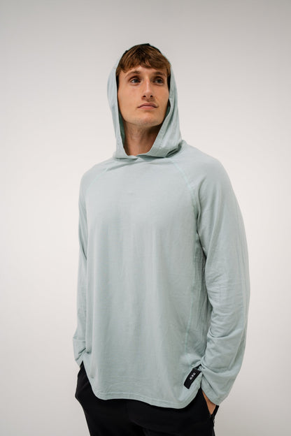 Male model wearing an ALL IN ALL mojito hoodie against a plain background